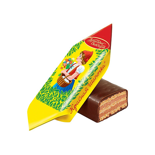 картинка Конфеты шоколадные "Красная шапочка" Красный Октябрь. Нежное пралине с ароматом ванили с добавлением тертого арахиса между слоями вафель. 250г – Prostor.ae